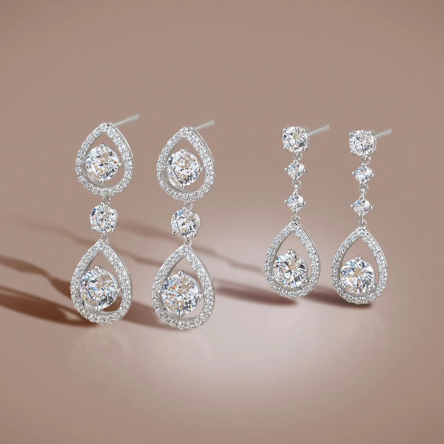 Regalia: Silver rhodium plated with 6.5mm 100 facets CZ victoria teardrop earrings