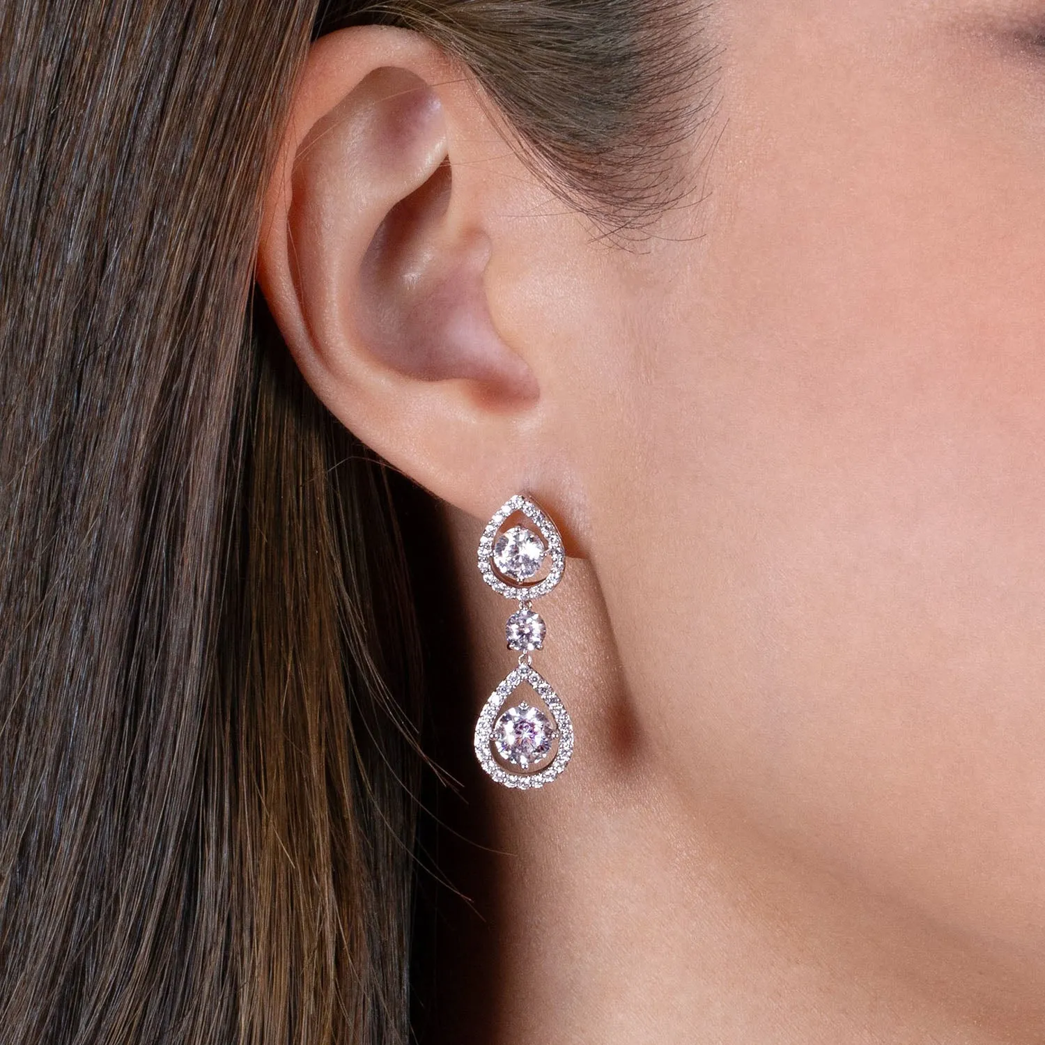 Regalia: Silver rhodium plated with 6.5mm 100 facets CZ victoria teardrop earrings